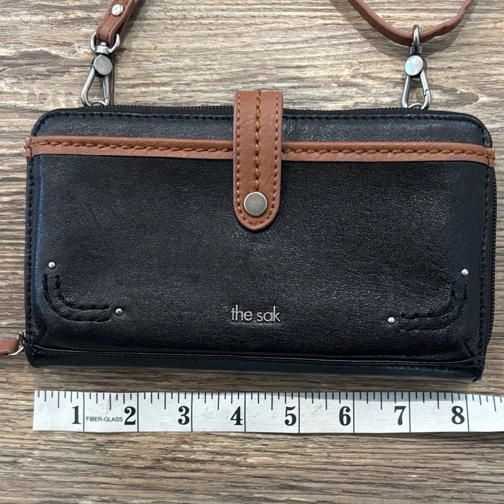 The Sak Large Smartphone Crossbody and Wristlet Leather Wallet Black and Brown